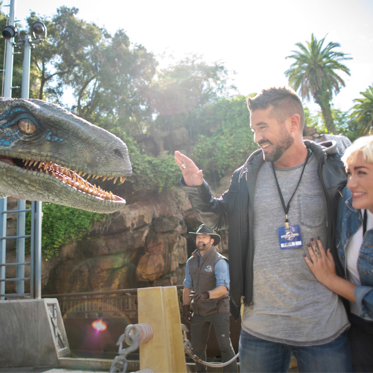 A couple express excitement and fear as they come face to face with a raptor on their VIP Experience Tour. 