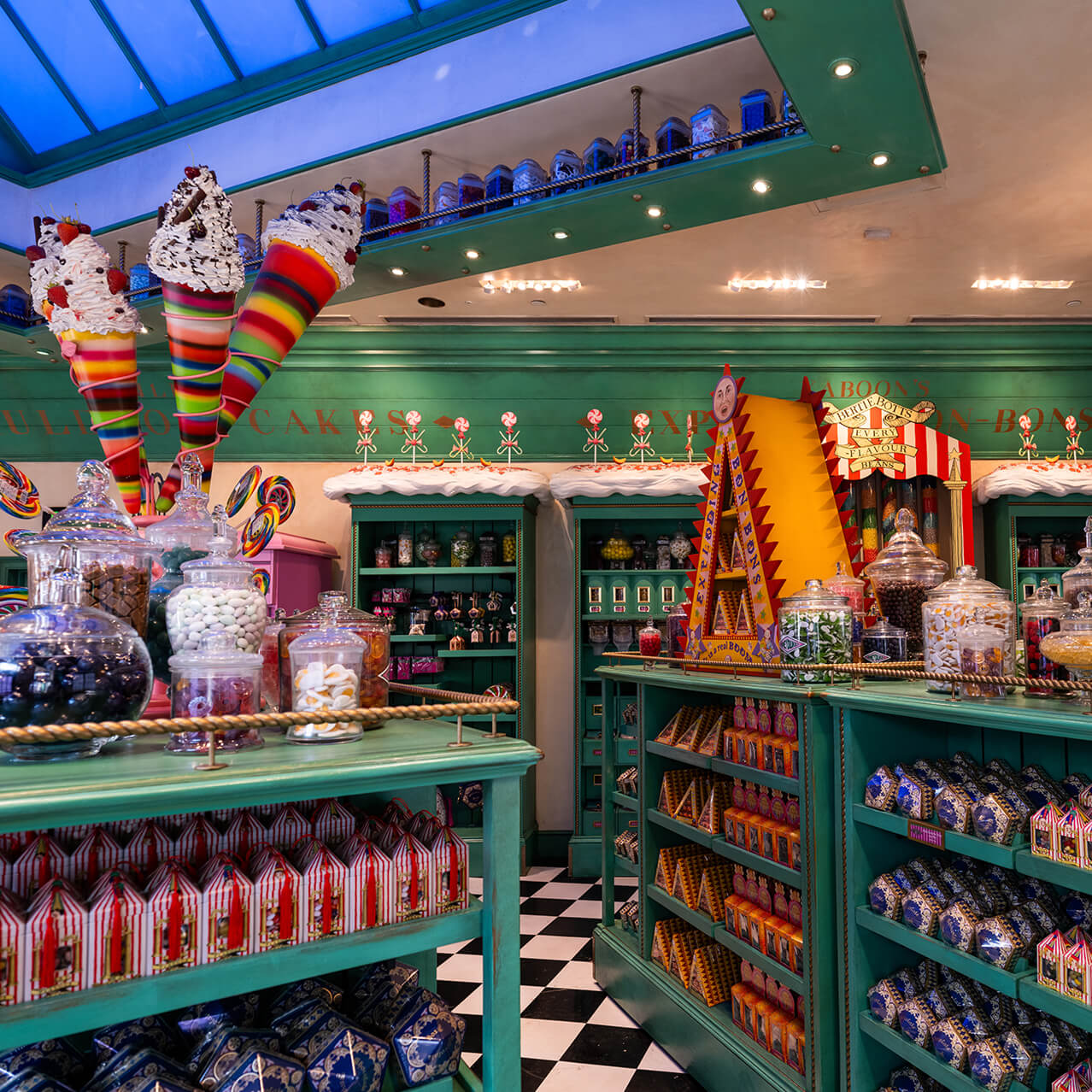 Countertops of candy llled kars and other dessert displays inside Honeydukes™ at Universal Studios Hollywood.