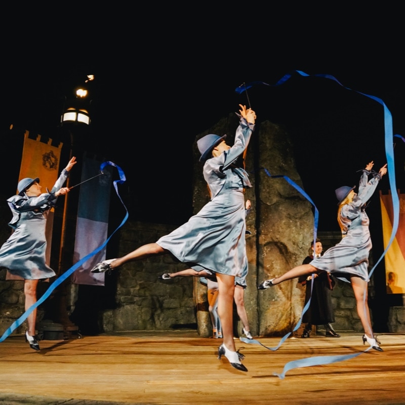 Show actors dance with ribbons